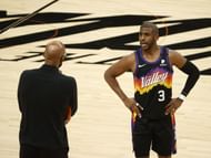 Chris Paul #3 of the Phoenix Suns talks with head coach Monty Williams.
